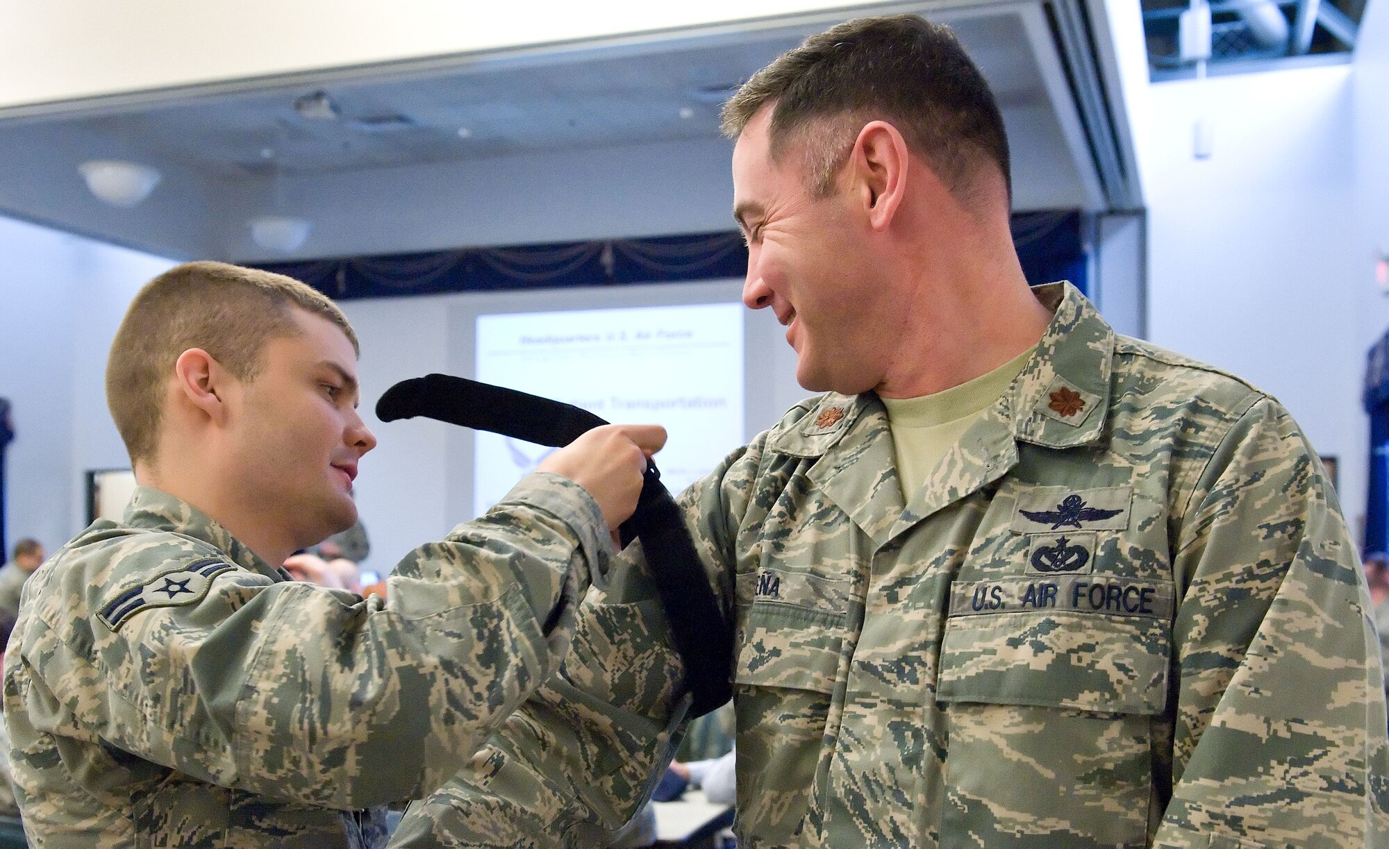 Airman 1st Class Alexander Bemis, left, 436th Communications Squadron transmission systems apprentice, applies a tourniquet to Maj. Steven Pena, 436th CS commander, April 7, 2014, at The Landings on Dover Air Force Base, Del. Team Dover members went through self-aid and buddy care training over a three-day period to prepare them for world-wide missions. (U.S. Air Force photo/Roland Balik)