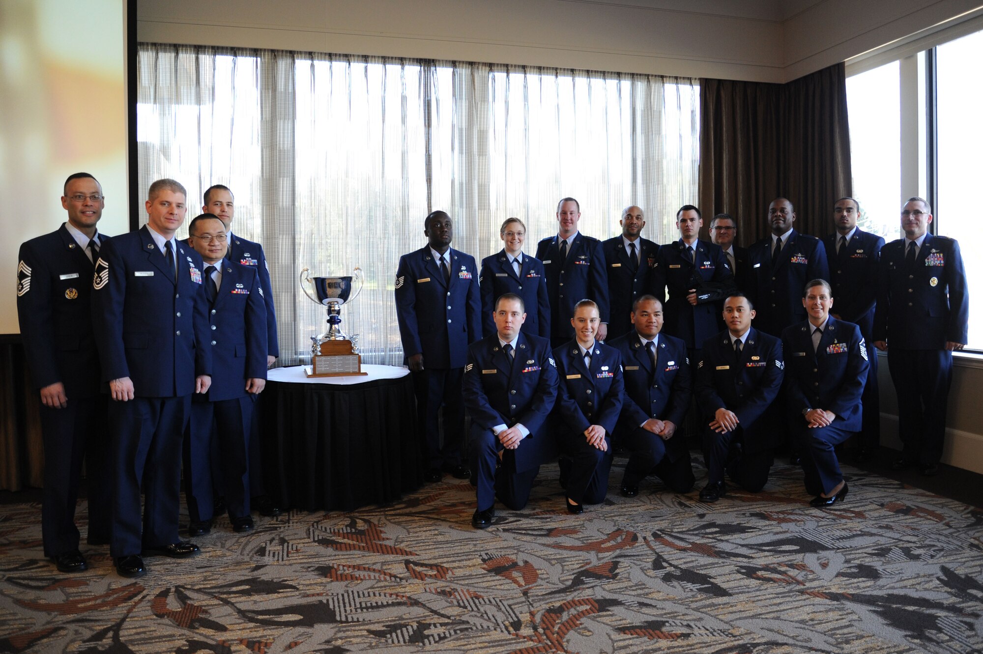 Members of the 92nd Communications Squadron pose for a photo during the Let Freedom Ring event held at the Red Lion Hotel at the Park, Spokane, Wash., April 11, 2014. Team Fairchild’s 92nd CS won the 2014 Foseen Trophy for their community support over the past year. Let Freedom Ring is an event to honor the Armed Forces Persons of the Year. (U.S. Air Force photo by Airman 1st Class Janelle Patiño/Released)