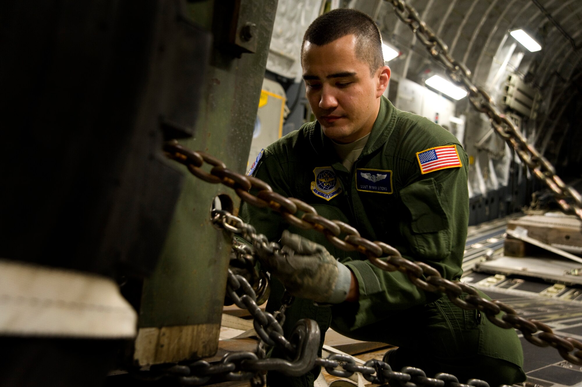 Staff Sgt. Ryan Otero, 3rd Airlift Squadron C-17 Globemaster III loadmaster, secures equipment inside the aircraft during a training sortie that was part of the East Coast Combat Operations Exercise 2014-04, April 7, 2014 at Dover Air Force Base, Del. ECCOEX is designed to assess wing deployment processes and capabilities. (U.S. Air Force photo/Staff Sgt. Elizabeth Morris)