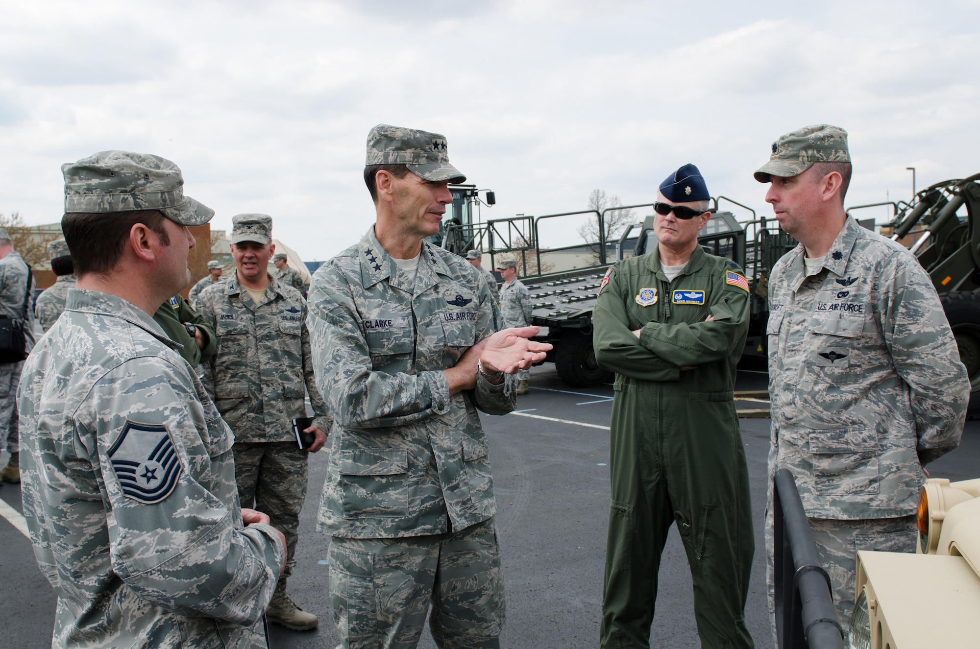 Lt. Gen. Stanley E. Clarke III, director of the Air National Guard, speaks with Lt. Col. David Mounkes (second from right) and Lt. Col. Bruce Bancroft (far right) of the 123rd Contingency Response Group during a tour of the Kentucky Air National Guard Base in Louisville, Ky., April 11, 2014. Clarke visited with Airmen from across the 123rd Airlift Wing and examined mission capabilities ranging from contingency response to special tactics. (U.S. Air National Guard photo by Airman 1st Class Joshua Horton)