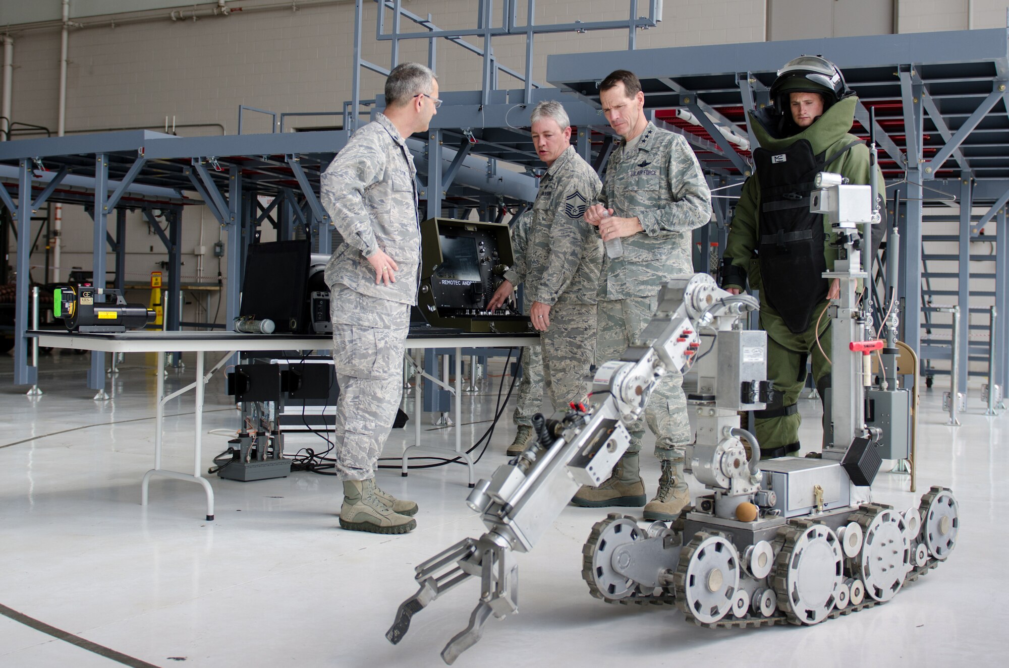 Senior Master Sgt. Shane LaGrone of the 123rd Explosive Ordnance Disposal Flight demonstrates an EOD robot to Lt. Gen. Stanley E. Clarke III, director of the Air National Guard, during a tour of the Kentucky Air National Guard Base in Louisville, Ky., April 11, 2014. Clarke visited with Airmen from across the 123rd Airlift Wing and examined mission capabilities ranging from contingency response to special tactics. (U.S. Air National Guard photo by Airman 1st Class Joshua Horton)