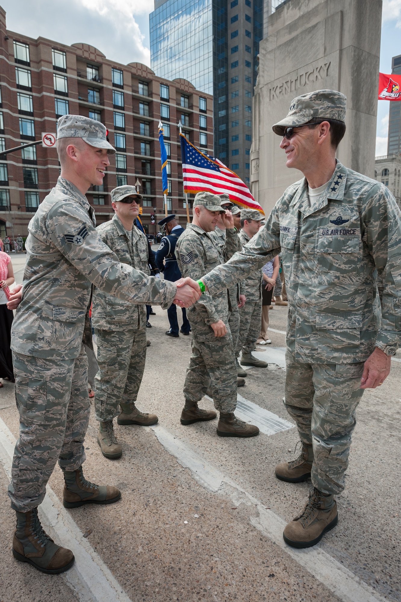Lt. Gen. Stanley E. Clarke III, director of the Air National Guard, greets Senior Airman Jordan Pate of the Kentucky Air Guard’s 123rd Airlift Wing prior to the opening ceremony for the Thunder Over Louisville air show in Louisville, Ky., April 12, 2014. Pate is one of 15 Kentucky Air Guardsmen who was sworn in by Clarke as part of the ceremony. (U.S. Air National Guard photo by Maj. Dale Greer)