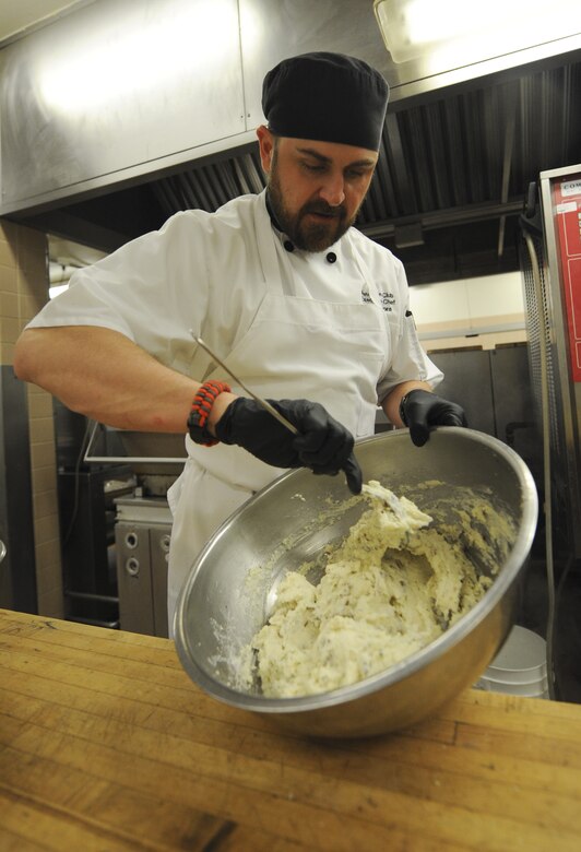 PETERSON AIR FORCE BASE, Colo. – Joe Zamora, 21st Force Support Squadron Peterson Club executive chef, prepares whipped potatoes from scratch for a distinguished visitor’s luncheon at the Peterson Club here April 2. Zamora and his new team are trying to change perceptions of food at the club to attract more customers. Their approach is to provide fresh high quality food and be customer friendly. (U.S. Air Force photo/Staff Sgt. Jacob Morgan) 