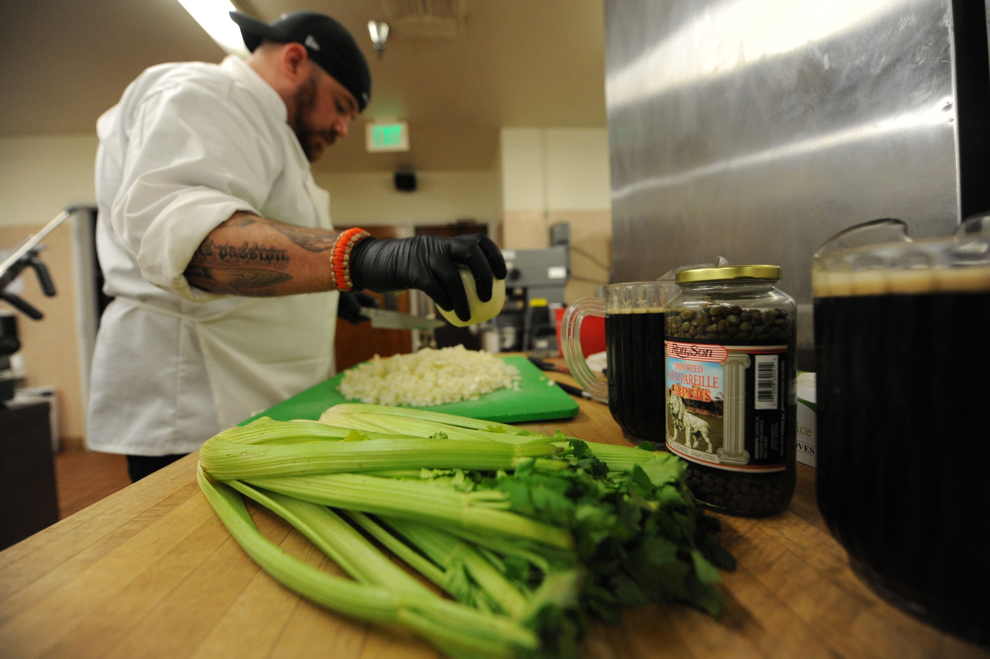 PETERSON AIR FORCE BASE, Colo. – Kirkland Dunning, 21st Force Support Squadron Peterson Club sous-chef, prepares beer cheese soup with fresh vegatables and beer April 1. The new team of chefs at the Peterson Club prepared ballpark-themed food for an opening day baseball-themed lunch. (U.S. Air Force photo/Staff Sgt. Jacob Morgan)