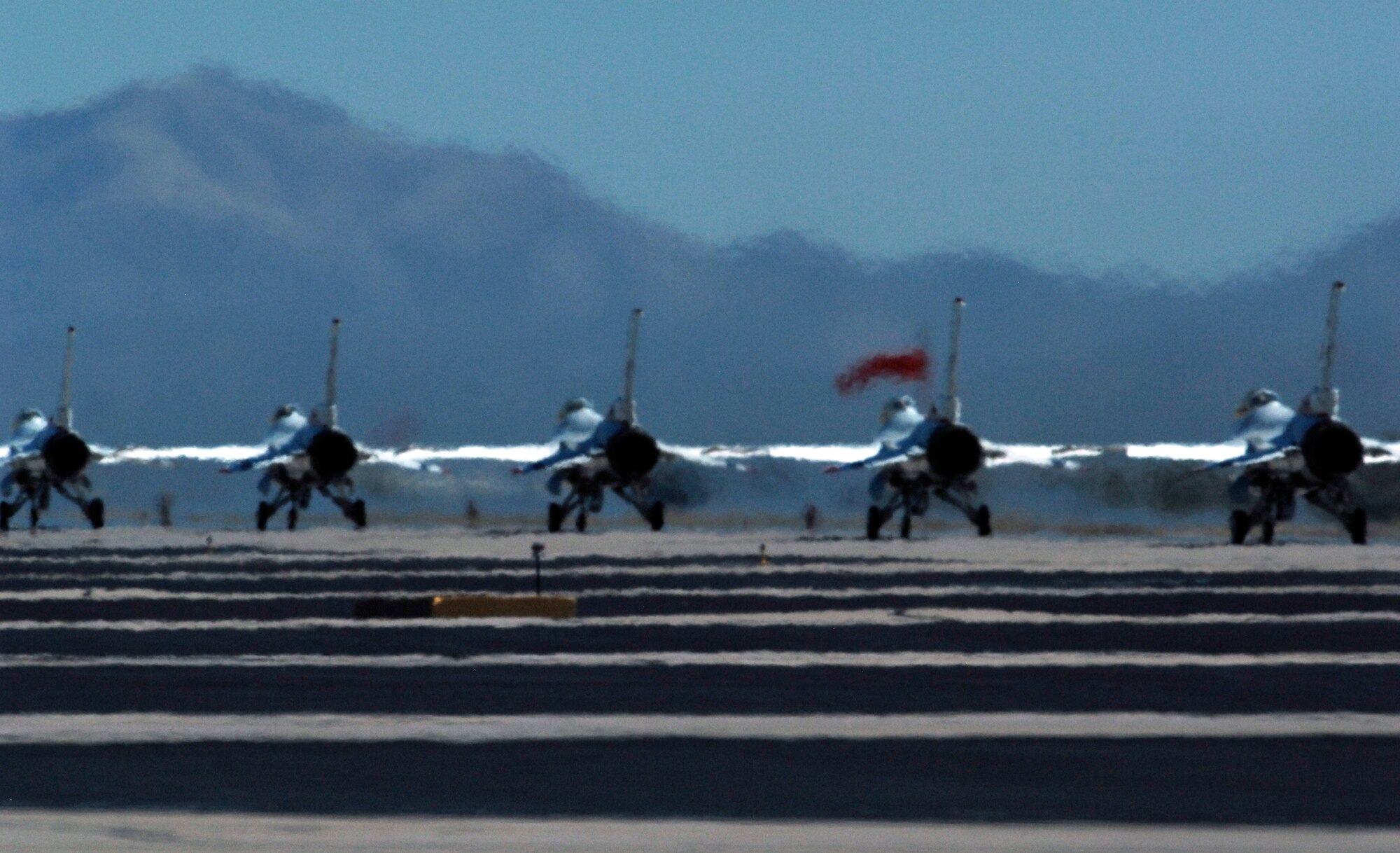 U.S. Air Force Thunderbirds Air Demonstration Squadron taxis down the runway after landing during the Thunder and Lightning over Arizona event at Davis-Monthan Air Force Base, Ariz., April 13, 2014. More than 300,000 people attended the event that featured 14 aerial demonstrations. (U.S. Air Force Photo by Airman 1st Class Chris Massey/Released)