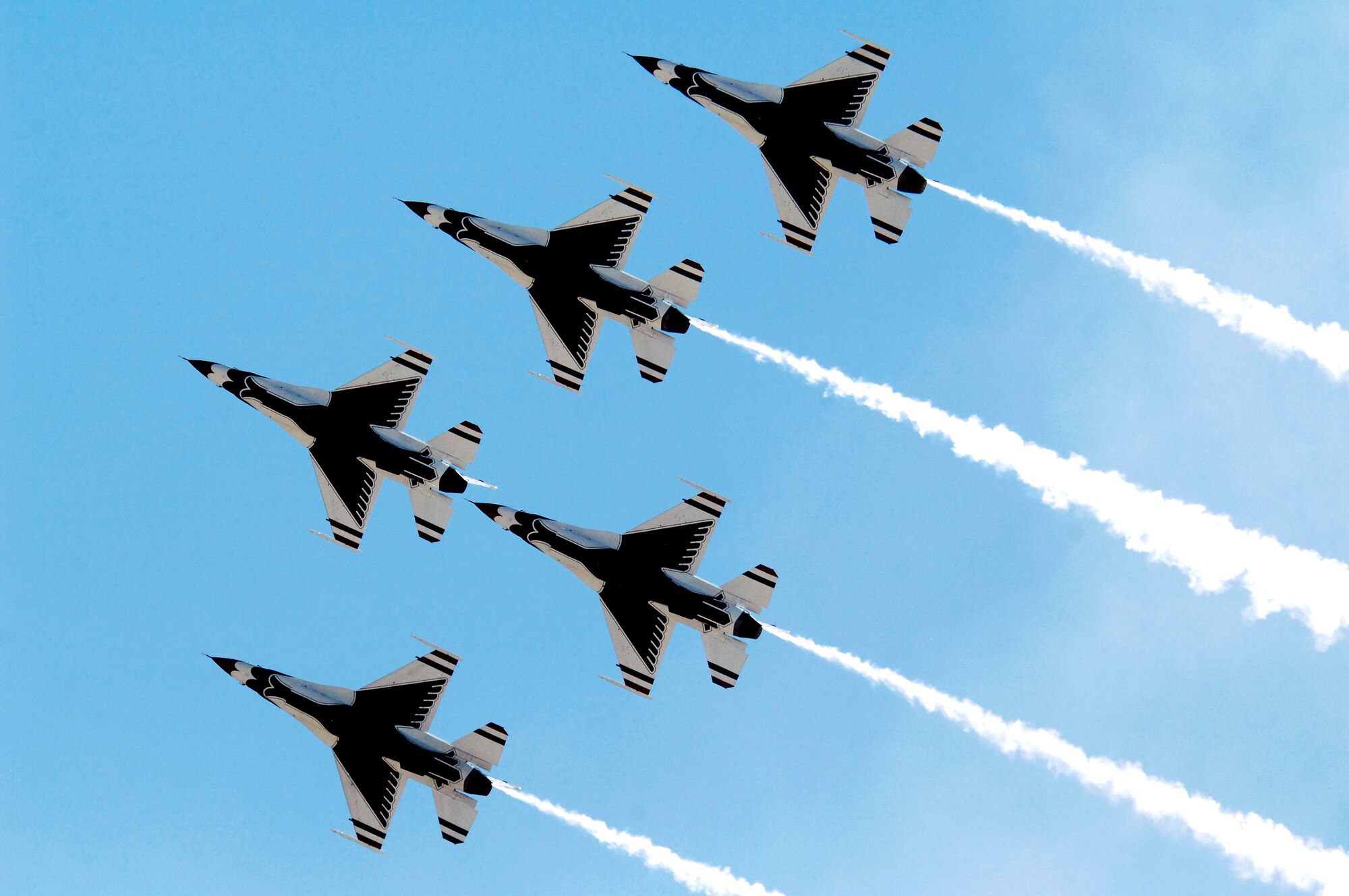 The U.S. Air Force Thunderbirds Air Demonstration Squadron flies in a formation during the Thunder and Lightning over Arizona event at Davis-Monthan Air Force Base, Ariz., April 13, 2014. The squadron has been performing aerial demonstrations for more than 60 years. (U.S. Air Force Photo by Airman 1st Class Chris Massey/Released)