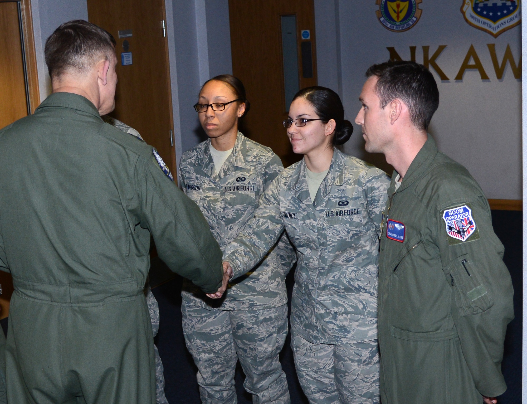 U.S. Air Force Gen. Frank Gorenc, U.S. Air Forces in Europe and Air Forces Africa commander, left, greets Airmen from the 100th Operations Group April 14, 2014, at Bldg. 809 on RAF Mildenhall, England. Gorenc toured the 100th OG during his visit to RAF Mildenhall. As part of his visit, Gorenc held an assembly, toured different squadrons of the 100th Air Refueling Wing and attended a Hearts Apart dinner. (U.S. Air Force photo by Airman 1st Class Kelsey Waters/Released)