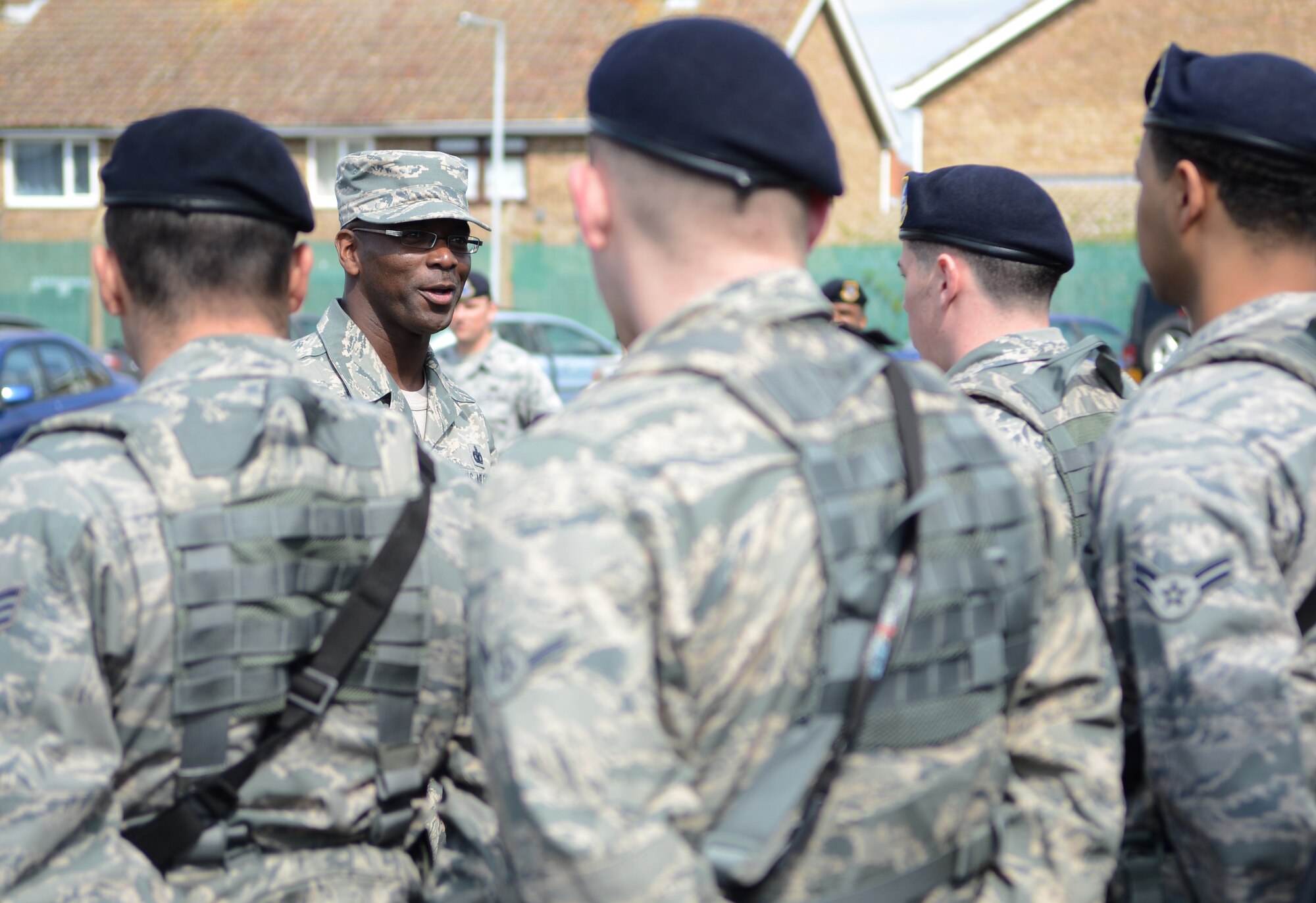 U.S. Air Force Chief Master Sgt. James E. Davis, U.S. Air Forces in Europe and Air Forces Africa command chief, speaks to 100th Security Forces Squadron personnel April 14, 2014, during a visit to RAF Mildenhall, England. During his time on base, the command chief visited with several Team Mildenhall members and toured various base facilities. (U.S. Air Force photo by Airman 1st Class Dillon Johnston/Released)