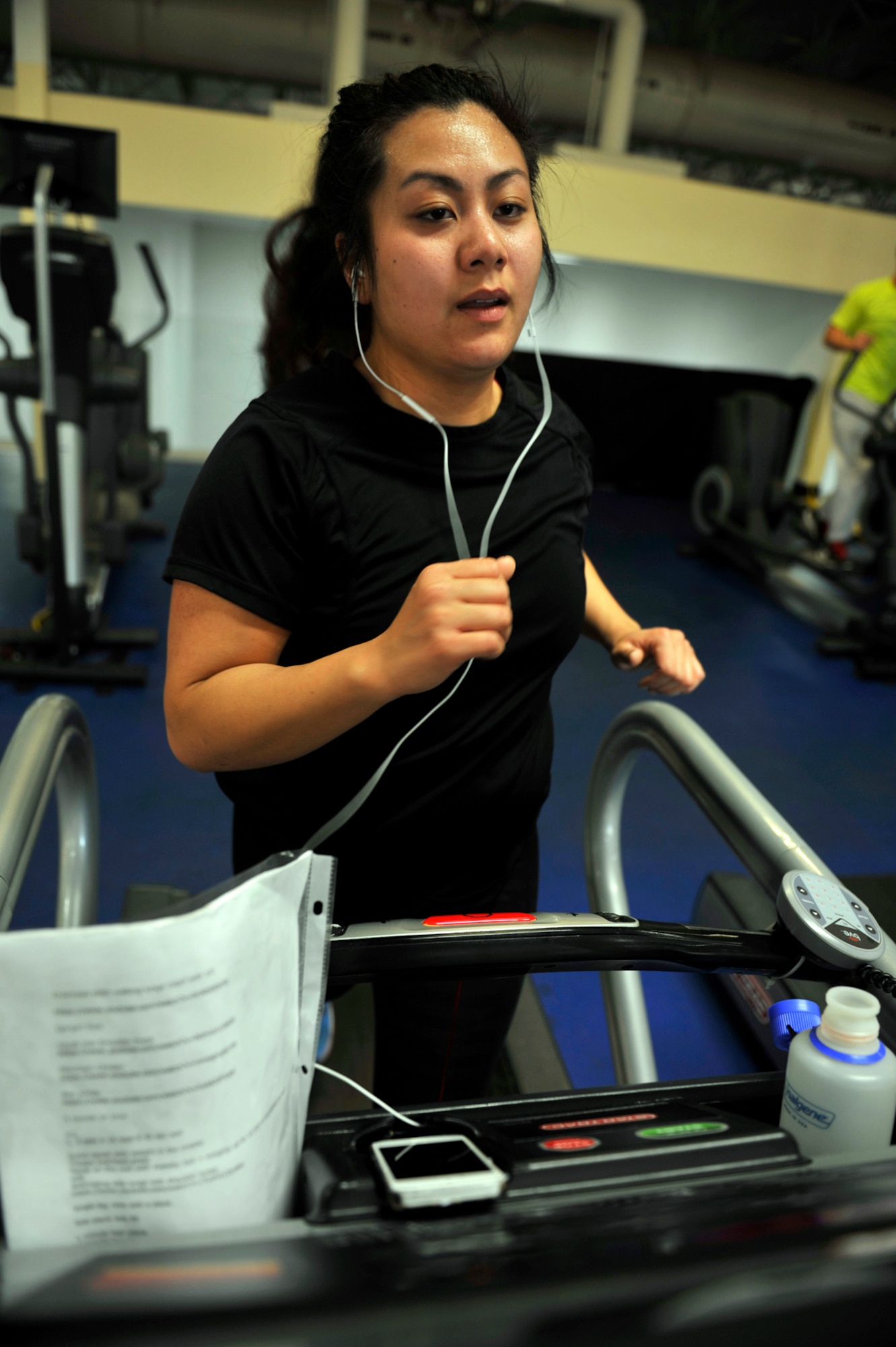May Saechao, Denali Child Development Center caregiver and a native of Anchorage, Alaska, runs on the treadmill at the JBER-E Fitness Center on Joint Base Elmendorf-Richardson, Alaska, April 9, 2014. The fitness centers are open to all Department of Defense identification card holders. For information about hours or events, contact the JBER-E Fitness Center at 552-5353 or Buckner Physical Fitness Center at 384-1308. (U.S. Air Force photo/Airman 1st Class Tammie Ramsouer)