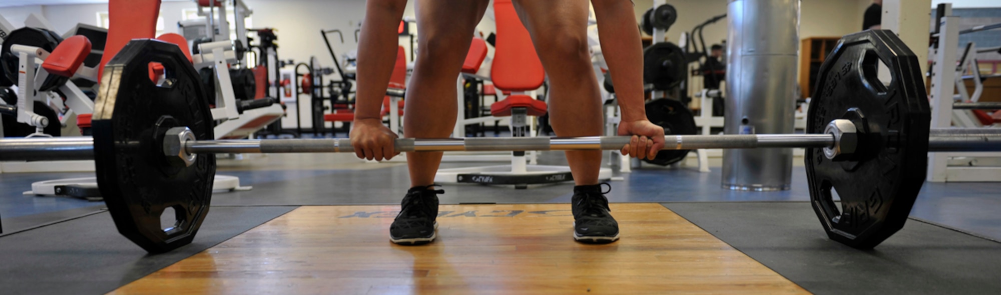 An individual deadlifts at the JBER-E Fitness Center on Joint Base Elmendorf-Richardson, Alaska, April 9, 2014. The fitness centers on JBER are open to all Department of Defense identification card holders. In addition to fitness equipment, the centers provide massage therapy, lap swimming and personal trainers. (U.S. Air Force photo/Airman 1st Class Tammie Ramsouer)