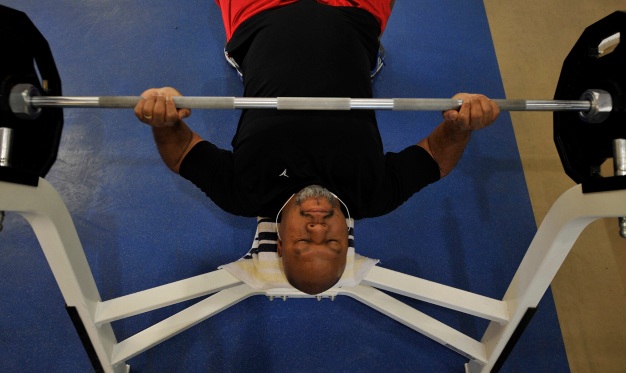 Alvin Nickson lifts 205 pounds at the JBER-E Fitness Center on Joint Base Elmendorf-Richardson, Alaska, April 9, 2014. Nickson, a native of Anchorage, Alaska, works at the Troop Medical Clinic on JBER-Richardson as a health systems specialist. He visits the fitness centers four days per week to keep in shape. (U.S. Air Force photo/Airman 1st Class Tammie Ramsouer)