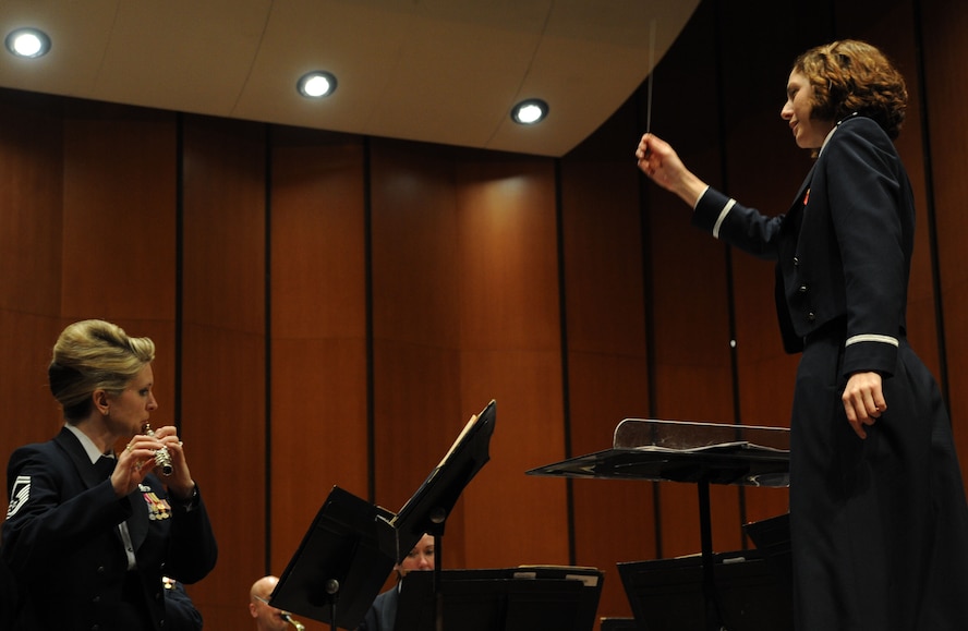 First Lt. Shanti Simon Nolan conducts during The U.S. Air Force Band Concert Band’s final performance of its 2014 Spring Tour at Michigan State University in East Lansing, Mich., April 13, 2014. Nolan earned her Doctor of Musical Arts Conducting from the University of Minnesota in 2011, and she is currently the officer in charge of the Air Force Strings, Airmen of Note and Max Impact ensembles. (U.S. Air Force photo/Master Sgt. Tammie Moore) 
