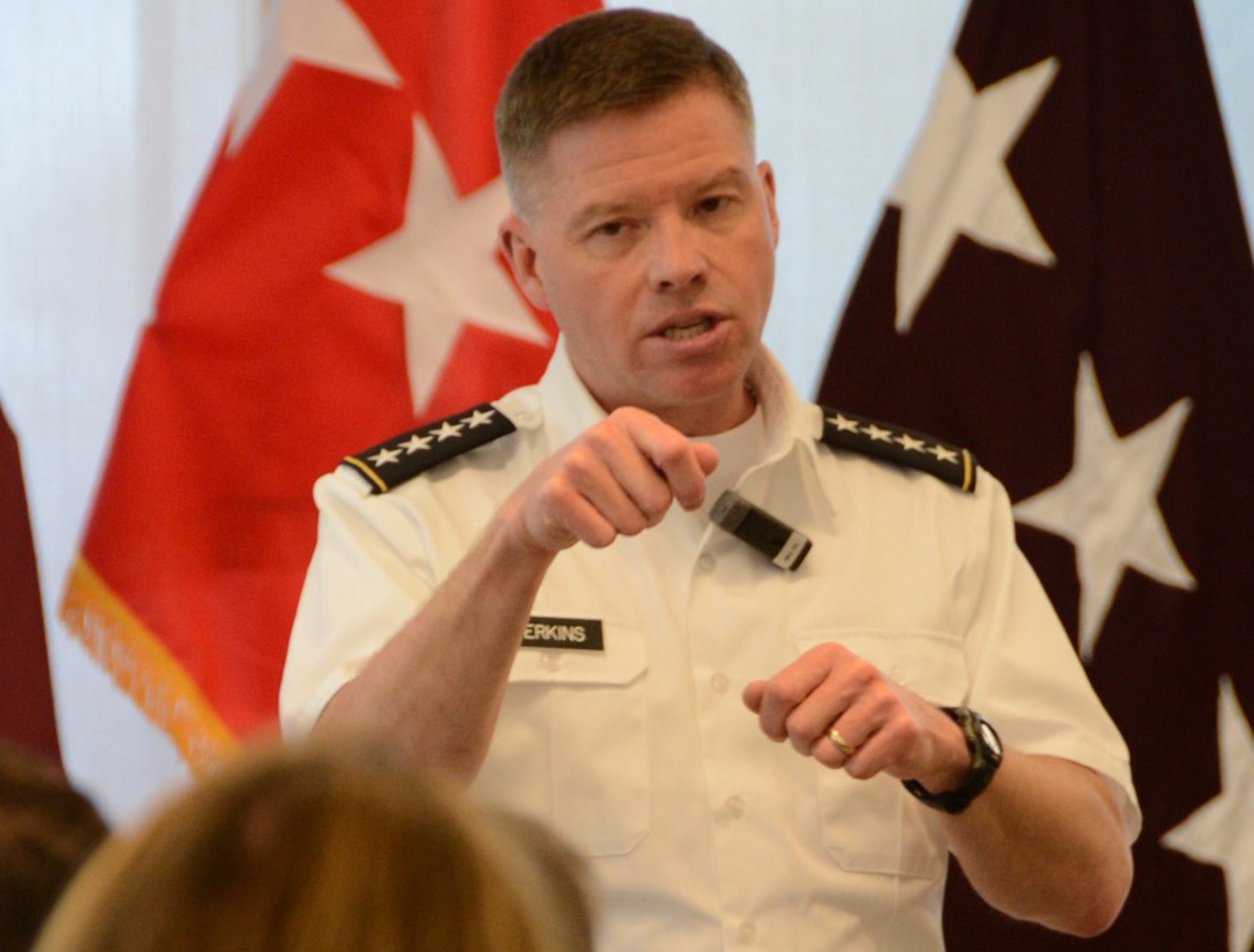 U.S. Army Gen. David G. Perkins, commander of the U.S. Army Training and Doctrine Command, speaks at the Brain Health Consortium, April 10, 2014, at Defense Health Headquarters in Falls Church, Va. Perkins announced the Army is conducting a complete re-assessment of its noncommissioned officer education system for the first time since 1976. (U.S. Army photo by Gary Sheftick/Released)