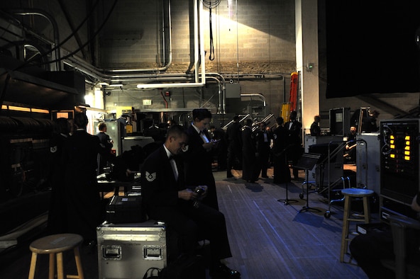 Airmen from The U.S. Air Force Band’s Concert Band and Singing Sergeants relax during intermission during their final 2014 Spring Tour performance at Michigan State University in East Lansing, Mich., April 13, 2014. This was the final show of the Band’s spring tour featuring the Concert Band, the Band’s largest ensemble, and the Singing Sergeants, the official chorus of the U.S. Air Force. (U.S. Air Force photo/Master Sgt. Tammie Moore)