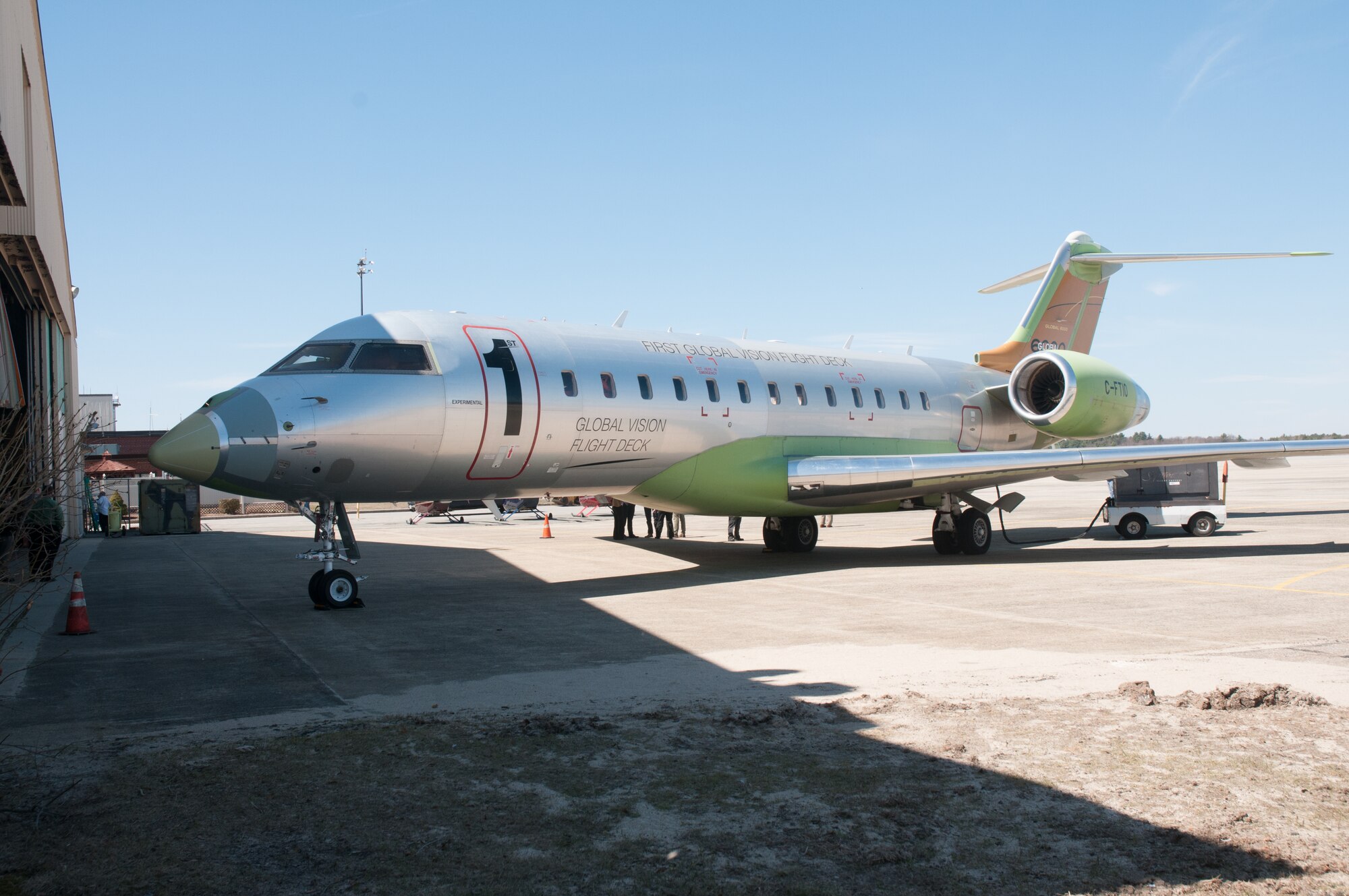 A Bombardier static display sits outside a hangar on Hanscom Air Force Base, Mass., April 10, 2014. More than 35 aircraft and communication companies gathered at the base to discuss potential business opportunities with the JSTARS Recapitalization program office. (U.S. Air Force photo by Mark Herlihy/Released) 
