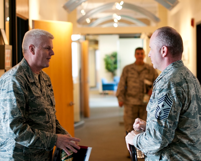 Col. James Johnson, Commander of the 133 Airlift Wing, says farewell and thanks Chief Master Sgt. James Hotaling, Command Chief of the Air National Guard, for visiting the wing in St. Paul Minn., Apr. 12, 2014. Chief Hotaling visited the wing to discuss the health of the Air Force, our commitment to the Profession of Arms and answered questions from Airmen. (U.S. Air National Guard photo by Staff Sgt. Austen Adriaens/Released)