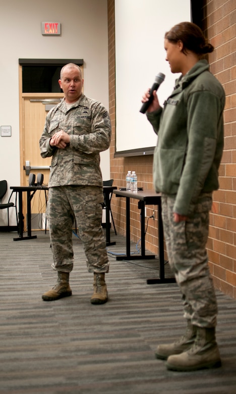 Chief Master Sgt. James Hotaling, Command Chief of the Air National Guard, asks Airmen 1st Class April Lackas questions about her experience in the Air Force in St. Paul Minn., Apr. 12, 2014. Chief Hotaling selected Airmen Lackas because she was the newest Airmen amongst the group. (U.S. Air National Guard photo by Staff Sgt. Austen Adriaens/Released)