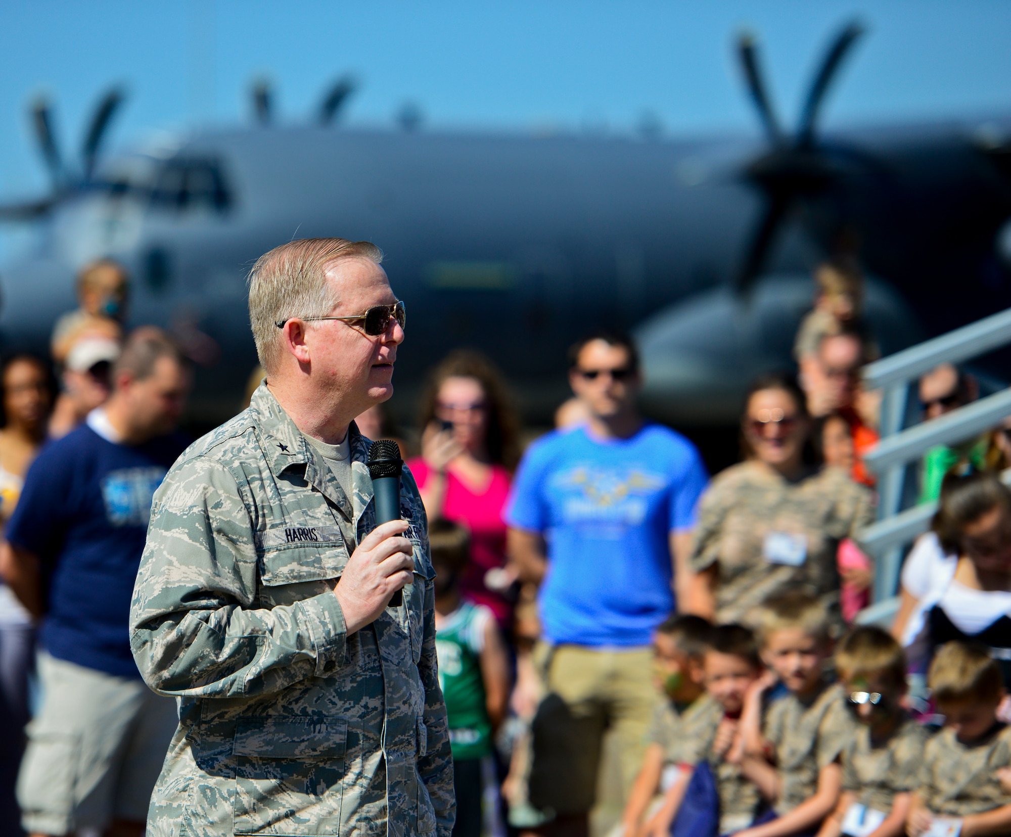 Brig. Gen. David Harris, the 96th Test Wing commander, addresses the first group of little deployers during Operation Hero April 12 at Eglin Air Force Base, Fla.  Nearly 400 adults and children participated in the program this year, which served as a way to help children understand the military and the deployment process their parents have or could face.  The kids went through a deployment line to get their uniforms, dog tags and shots before they were briefed by their commander and shipped off to a deployed location.  There, they encountered military demonstrations, equipment and obstacle courses.  (U.S. Air Force photo/Samuel King Jr.)