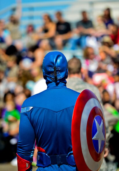 Captain America stands in front of a group of deployers during Operation Hero April 12 at Eglin Air Force Base, Fla.  Nearly 400 adults and children participated in the program this year, which served as a way to help children understand the military and the deployment process their parents have or could face.  The kids went through a deployment line to get their uniforms, dog tags and shots before they were briefed by their commander and shipped off to a deployed location.  There, they encountered military demonstrations, equipment and obstacle courses.  (U.S. Air Force photo/Samuel King Jr.)