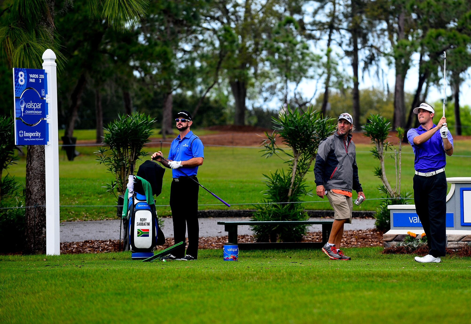 Rory Sabbatini, professional golfer, and Airman 1st Class Dalton Dishman, 6th Operations Support Squadron, watch the ball fly through the air during the Valspar Championship Pro-Am at Innisbrook Resort, Palm Harbor, Fla., March 12, 2014. After winning the MacDill Air Force Base golf championship, Dishman was informed that he would play with Rory Sabbatini, professional golfer, in the Valspar Championship Pro-Am. (U.S. Air Force photo by Senior Airman Melanie Bulow-Gonterman/Released)