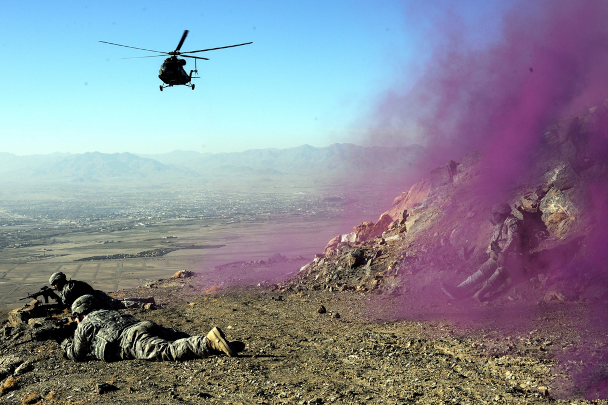 Security forces from Provincial Reconstruction Team Ghazni secure a landing zone while Polish medics arrive to provide medical care in Ghazni province, Afghanistan. Poles and militaries from other Eastern European countries participated in Iraq and Afghanistan with the hope that someday when they need military assistance, the U.S. would provide it, said Robert D. Kaplan, chief geopolitical analyst for Stratfor. (U.S. Air Force file photo)