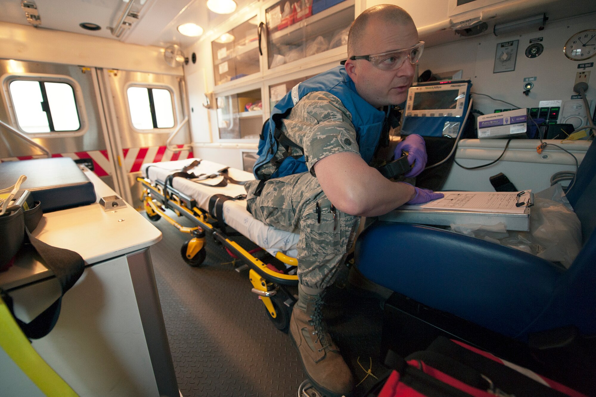 U.S. Air Force Maj. John Kitsteiner, 65th Medical Operation Squadron physician, prepares to administer medical care to a patient during a medical evacuation mission here, April 11, Lajes Field, Azores.  A U.S. Navy Sailor required medical evacuation to Lajes Field due to acute abdominal pain.  First responders with the 65th Medical Group provided emergent care to the Sailor before the patient was transferred to a local hospital for care.  (U.S. Air Force photo by Tech. Sgt. Paul Villanueva II/Released)
