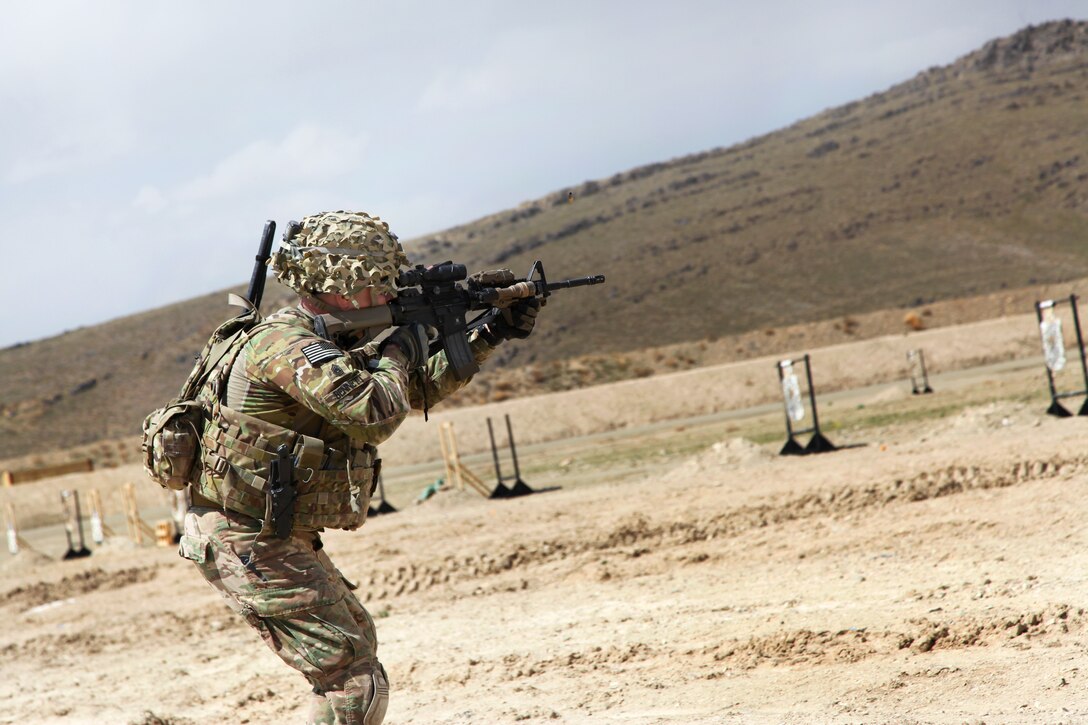 U.S. Army Command Sgt. Maj. William Bennett fires his M4 rifle during weapons qualification at a range on Forward Operating Base Thunder in Afghanistan's Paktia province, April 12, 2014. Bennett, a senior enlisted advisor, is assigned to 10th Mountain Division's Brigade Special Troops Battalion, 3rd Brigade Combat Team.