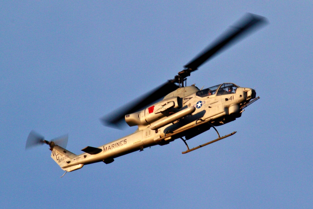 A Marine Corps AH-1W Super Cobra helicopter provides aerial security during a training exercise on Fort Dix, N.J., April 10, 2014.
