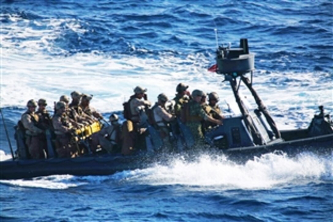 Marines travel aboard a rigid hull inflatable boat in a visit, board, search and seizure training mission during Amphibious Squadron Marine Expeditionary Unit Integration Training off the coast of San Diego, April 11, 2014. Marines conduct amphibious operations, crisis response and contingency during the two-week predeployment training.