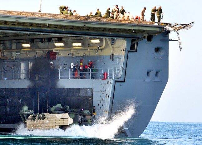 All Networking On-the-Move-equipped Assault Amphibious Vehicle testing was conducted within a realistic, operational framework. This included transitioning of the NOTM-AAV in and out of surf, traveling extended distances in differing sea states and terrain surfaces, and the boarding and disembarking from the USS Anchorage, the amphibious transport dock ship shown here operating off the coast of Camp Pendleton, Calif. 