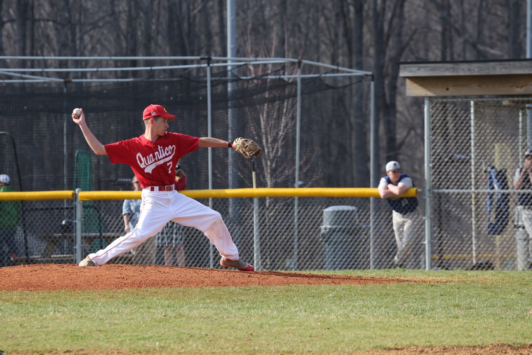 Treyton, a junior for the Quantico Middle/High School Warrior Baseball Team, delivers a pitch during a game against the Vendeens of the Holy Family Academy from Manassas, at George Hellwig Memorial Park in Manassas on April 9, 2014. The Warriors kept the lead the whole game but couldn't hold on in the last inning, losing 11-10.