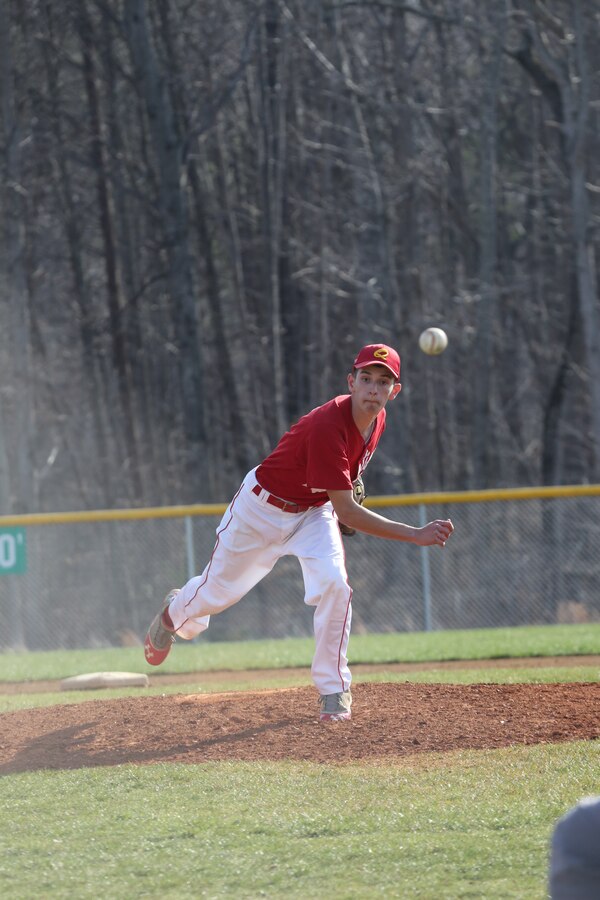 Treyton, a junior for the Quantico Middle/High School Warrior Baseball Team, delivers a pitch during a game against the Vendeens of the Holy Family Academy from Manassas, at George Hellwig Memorial Park in Manassas on April 9, 2014. The Warriors kept the lead the whole game but couldn't hold on in the last inning, losing 11-10.