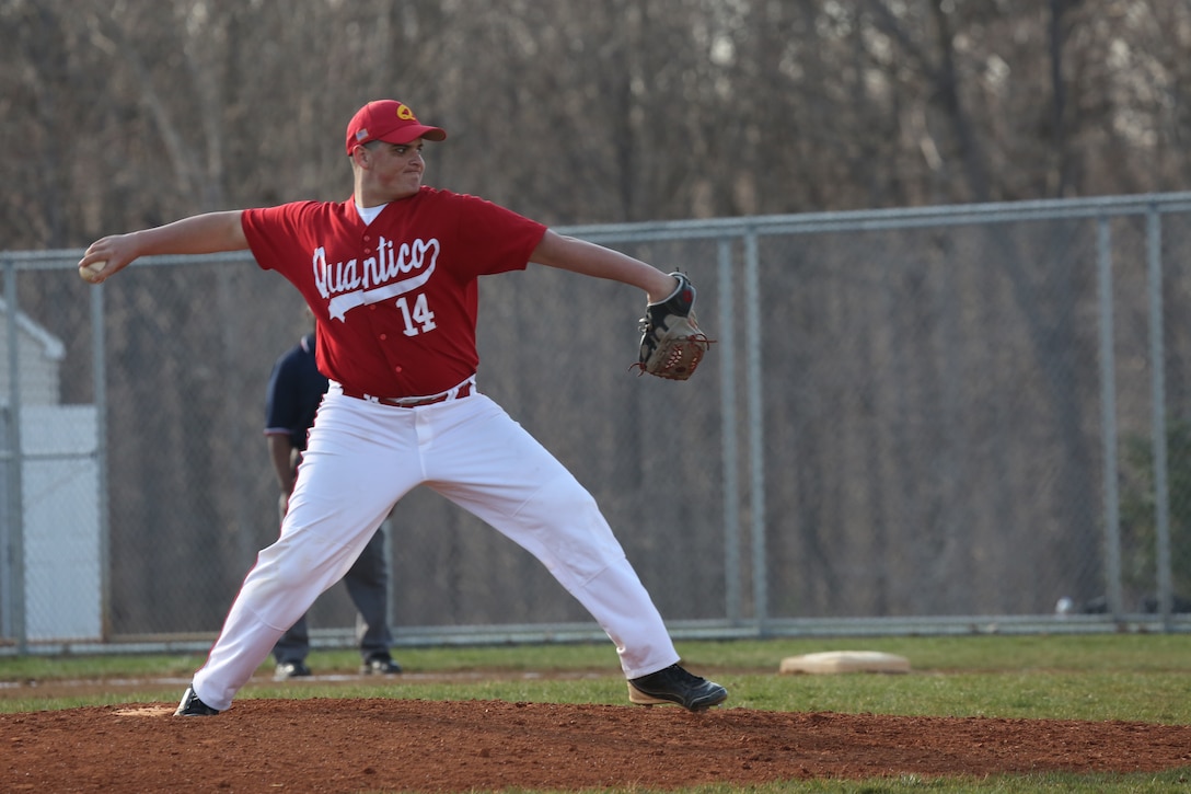 Alec, a senior for the Quantico Middle/High School Warrior Baseball Team, delivers a pitch during a game against the Vendeens of the Holy Family Academy from Manassas, at George Hellwig Memorial Park in Manassas on April 9, 2014. The Warriors kept the lead the whole game but couldn't hold on in the last inning, losing 11-10.