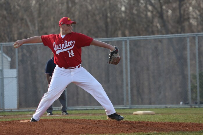 Alec, a senior for the Quantico Middle/High School Warrior Baseball Team, delivers a pitch during a game against the Vendeens of the Holy Family Academy from Manassas, at George Hellwig Memorial Park in Manassas on April 9, 2014. The Warriors kept the lead the whole game but couldn't hold on in the last inning, losing 11-10.