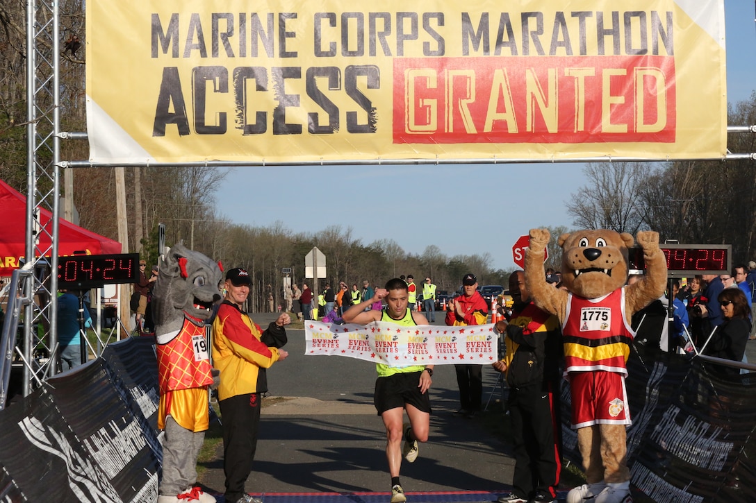 Steven Henry, from Odenton, Md., and a retired U.S. Army infantry soldier, crosses the finish line of the 2014 Marine Corps 17.75K at Prince William Forest Park in Prince William County on April 12, 2014. Henry completed the unique course in 1 hour, 4 minutes and 24 seconds.