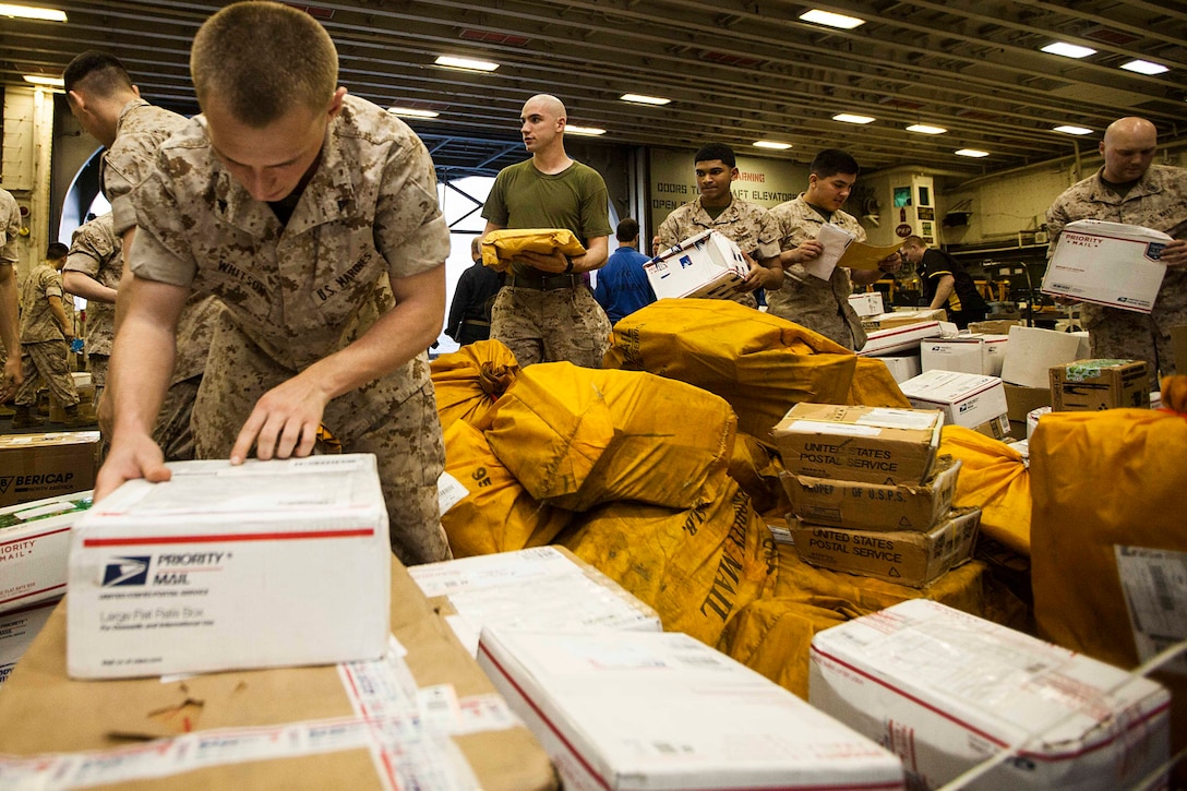 U.S. Marines sort through more than 4,200 pounds of mail aboard the USS Bataan (LHD 5) after a replenishment at sea with the USNS Richard E. Byrd (T-AKE 4) dry cargo/ammunition ship. The 22nd Marine Expeditionary Unit is deployed with the Bataan Amphibious Ready Group as a theater reserve and crisis response force throughout U.S. Central Command and the U.S. 5th Fleet area of responsibility.