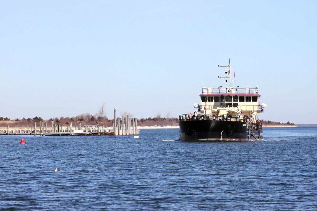 The Shallow Draft Dredge MURDEN clears shoaling from Barnegat Inlet, N.J. in April of 2014. The vessel was designed by the U.S. Army Corps of Engineers' Marine Design Center in Philadelphia and is based out of Wilmington, N.C. Barnegat Inlet requires dredging to provide reliable maritime navigation for the U.S. Coast Guard and a large fishing fleet consisting of full-time commercial, charter and recreational vessels.