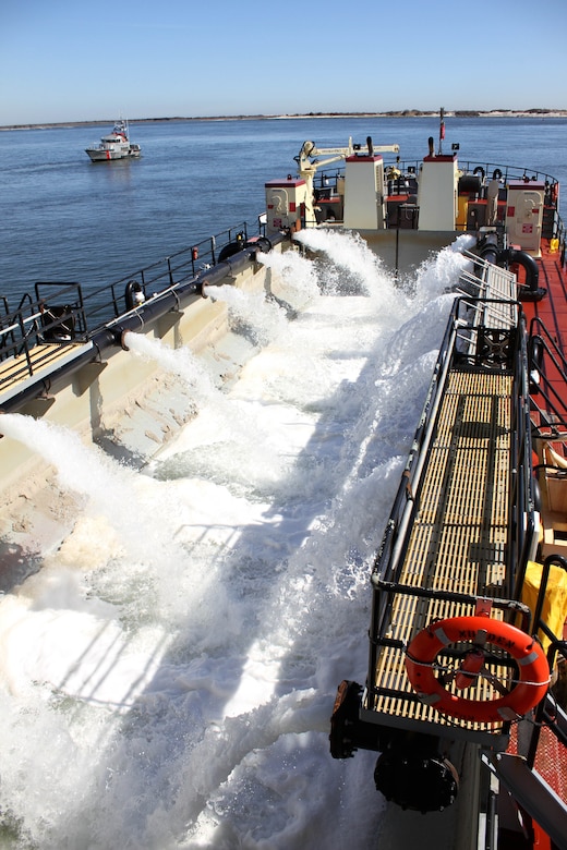 The Shallow Draft Dredge MURDEN clears shoaling from Barnegat Inlet, N.J. in April of 2014. The vessel was designed by the U.S. Army Corps of Engineers' Marine Design Center in Philadelphia and is based out of Wilmington, N.C. Barnegat Inlet requires dredging to provide reliable maritime navigation for the U.S. Coast Guard and a large fishing fleet consisting of full-time commercial, charter and recreational vessels.