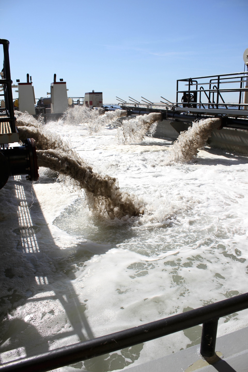 The Shallow Draft Dredge MURDEN clears shoaling from Barnegat Inlet, N.J. in April of 2014. The vessel was designed by the U.S. Army Corps of Engineers' Marine Design Center in Philadelphia and is based out of Wilmington, N.C. Barnegat Inlet requires dredging to provide reliable maritime navigation for the U.S. Coast Guard and a large fishing fleet consisting of full-time commercial, charter and recreational vessels.