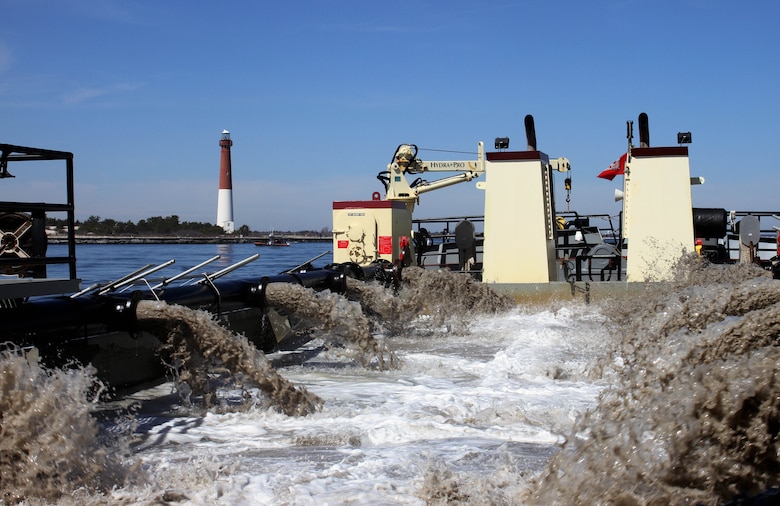 The Shallow Draft Dredge MURDEN clears shoaling from Barnegat Inlet, N.J. in April of 2014. The vessel was designed by the U.S. Army Corps of Engineers' Marine Design Center in Philadelphia and is based out of Wilmington, N.C. Barnegat Inlet requires dredging to provide reliable maritime navigation for the U.S. Coast Guard and a large fishing fleet consisting of full-time commercial, charter and recreational vessels.