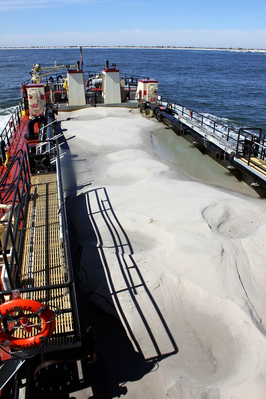 The Shallow Draft Dredge MURDEN clears shoaling from Barnegat Inlet, N.J. in April of 2014. The vessel was designed by the U.S. Army Corps of Engineers' Marine Design Center in Philadelphia and is based out of Wilmington, N.C. Barnegat Inlet requires dredging to provide reliable maritime navigation for the U.S. Coast Guard and a large fishing fleet consisting of full-time commercial, charter and recreational vessels.