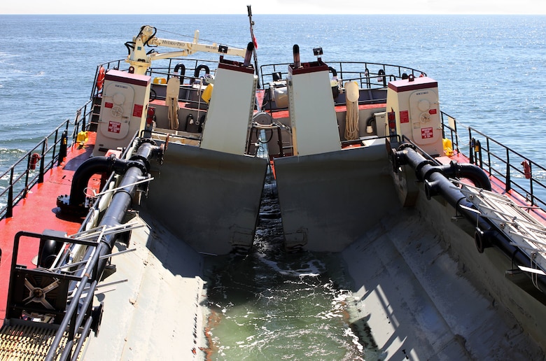 The Shallow Draft Dredge MURDEN clears shoaling from Barnegat Inlet, N.J. in April of 2014. The vessel was designed by the U.S. Army Corps of Engineers' Marine Design Center in Philadelphia and is based out of Wilmington, N.C. Barnegat Inlet requires dredging to provide reliable maritime navigation for the U.S. Coast Guard and a large fishing fleet consisting of full-time commercial, charter and recreational vessels.