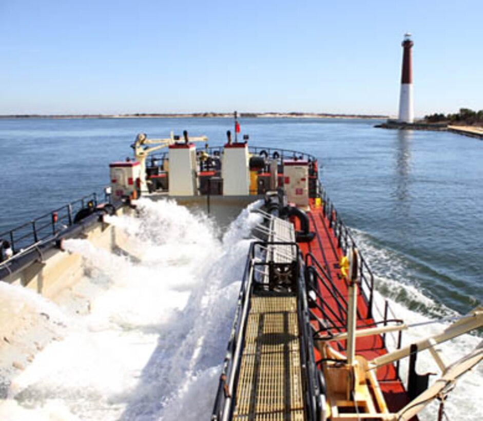 The Shallow Draft Dredge MURDEN clears shoaling from Barnegat Inlet, N.J. in April of 2014. The vessel was designed by the U.S. Army Corps of Engineers' Marine Design Center in Philadelphia and is based out of Wilmington, N.C. Barnegat Inlet requires dredging to provide reliable maritime navigation for the U.S. Coast Guard and a large fishing fleet consisting of full-time commercial, charter and recreational vessels.