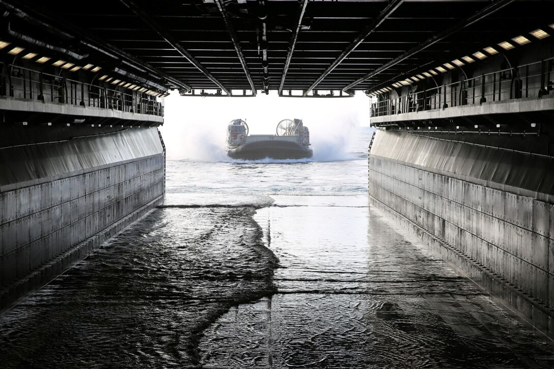 A landing craft air cushion approaches the USS Makin Island carrying Marines, vehicles, and equipment from the 11th Marine Expeditionary Unit during Amphibious Squadron Marine Expeditionary Unit Integration Training (PMINT) off the coast of San Diego, April 11. The 11th MEU, partnered with the Makin Island Amphibious Ready Group, is conducting PMINT in preparation for an upcoming deployment. (U.S. Marine Corps photo by Sgt. Melissa Wenger/Released)