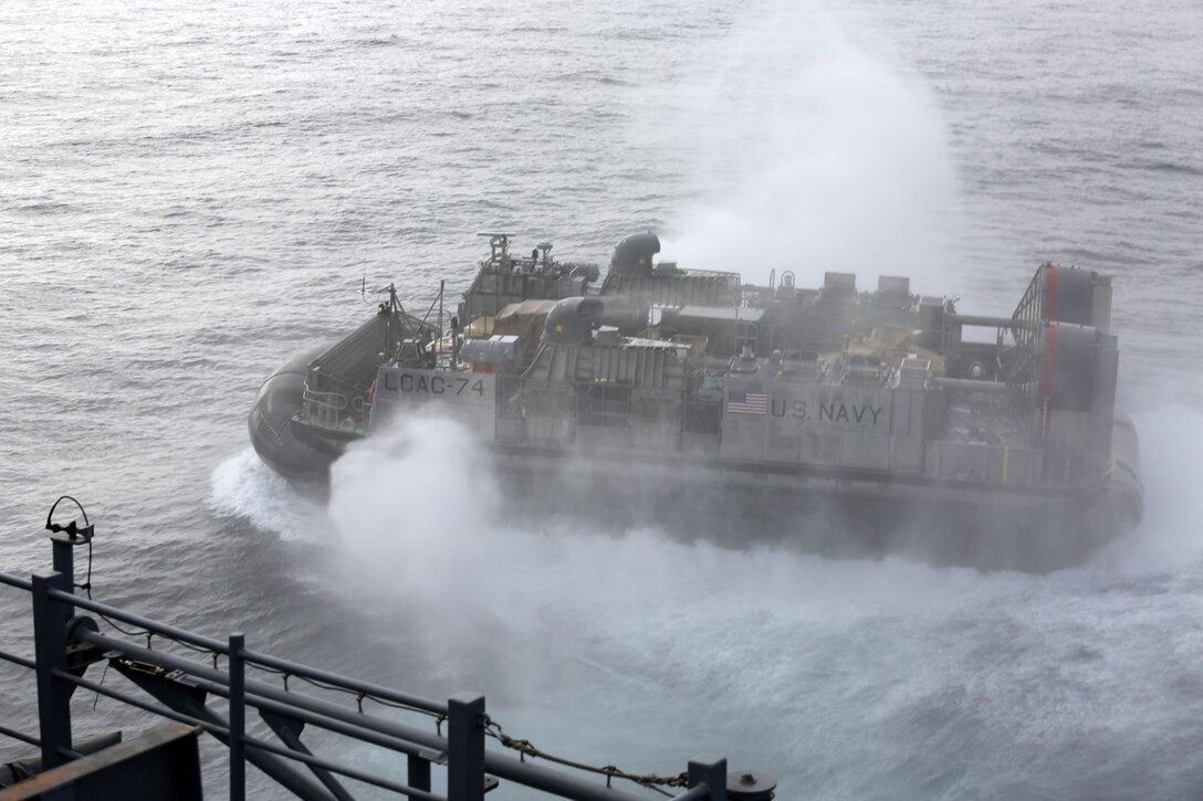 A landing craft air cushion deploys from the USS Makin Island carrying Marines, vehicles, and equipment from the 11th Marine Expeditionary Unit during Amphibious Squadron Marine Expeditionary Unit Integration Training (PMINT) off the coast of San Diego, April 11. The 11th MEU, partnered with the Makin Island Amphibious Ready Group, is conducting PMINT in preparation for an upcoming deployment. (U.S. Marine Corps photo by Sgt. Melissa Wenger/Released)