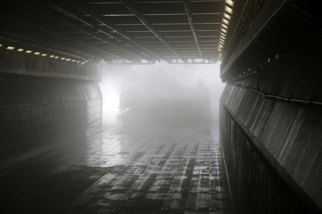 A landing craft air cushion deploys from the USS Makin Island carrying Marines, vehicles, and equipment from the 11th Marine Expeditionary Unit during Amphibious Squadron Marine Expeditionary Unit Integration Training (PMINT) off the coast of San Diego, April 11. The 11th MEU, partnered with the Makin Island Amphibious Ready Group, is conducting PMINT in preparation for an upcoming deployment. (U.S. Marine Corps photo by Sgt. Melissa Wenger/Released)