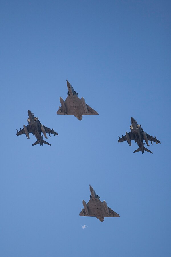 Two French air force Mirage 2000 fighter jets with Fighter Squadron 03/011 Corsica fly in formation with two U.S. Marine Corps AV-8B Harriers with Marine Medium Tiltrotor Squadron (VMM) 263 (Reinforced), 22nd Marine Expeditionary Unit (MEU), during an air-to-air and air-to-ground combat exercise at French Airbase 188. The 22nd MEU is deployed with the Bataan Amphibious Ready Group as a theater reserve and crisis response force throughout U.S. Central Command and the U.S. 5th Fleet area of responsibility.