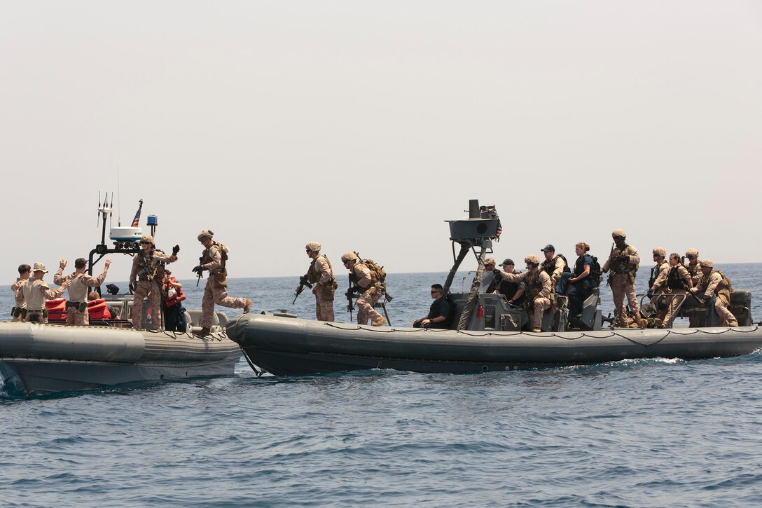Reconnaissance Marines with Battalion Landing Team 1st Battalion, 6th Marine Regiment, 22nd Marine Expeditionary Unit (MEU), board a simulated suspect civilian craft during maritime interdiction operations training. The 22nd MEU is deployed with the Bataan Amphibious Ready Group as a theater reserve and crisis response force throughout U.S. Central Command and the U.S. 5th Fleet area of responsibility.