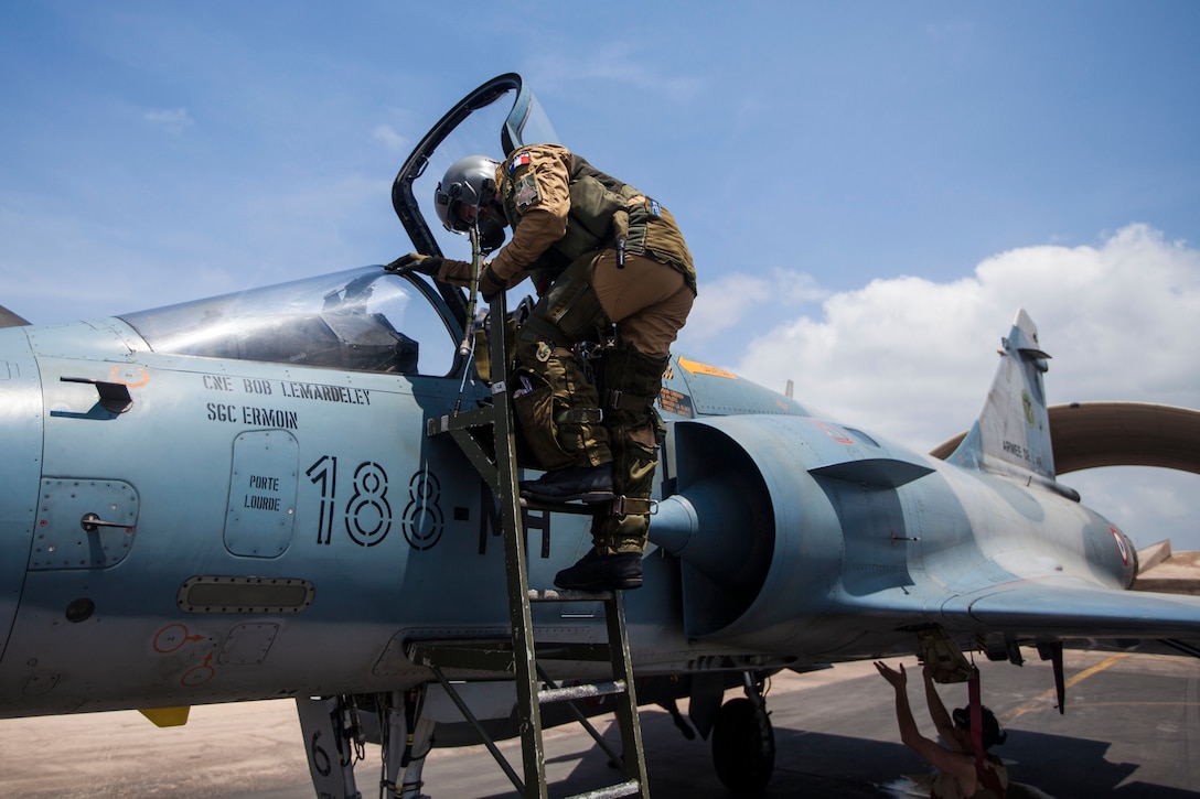 French air force 1st Lt. Thomas Troestler, Mirage 2000 fighter jet pilot with Fighter Squadron 03/011 Corsica, exits his jet at French Airbase 188 after an air-to-air combat exercise with AV-8B Harriers assigned to Marine Medium Tiltrotor Squadron (VMM) 263 (Reinforced), 22nd Marine Expeditionary Unit (MEU). The 22nd MEU is deployed with the Bataan Amphibious Ready Group as a theater reserve and crisis response force throughout U.S. Central Command and the U.S. 5th Fleet area of responsibility.