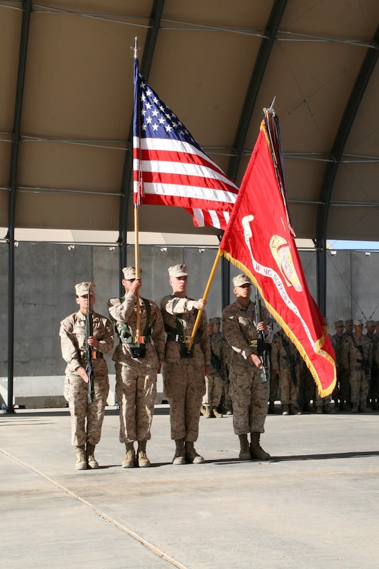 Marines with Marine Wing Support Squadron 372 present the national and unit battle colors during a transfer of authority ceremony held aboard Camp Bastion, Afghanistan, April 7, 2014. Marine Wing Support Squadron 372 was replaced by MWSS-274, which took on the responsibility of providing ground support for the aviation combat element with Regional Command (Southwest).